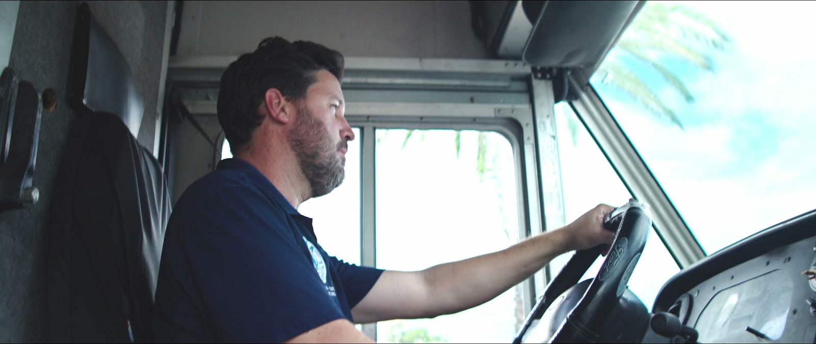 Aroma driver at the wheel of his delivery truck